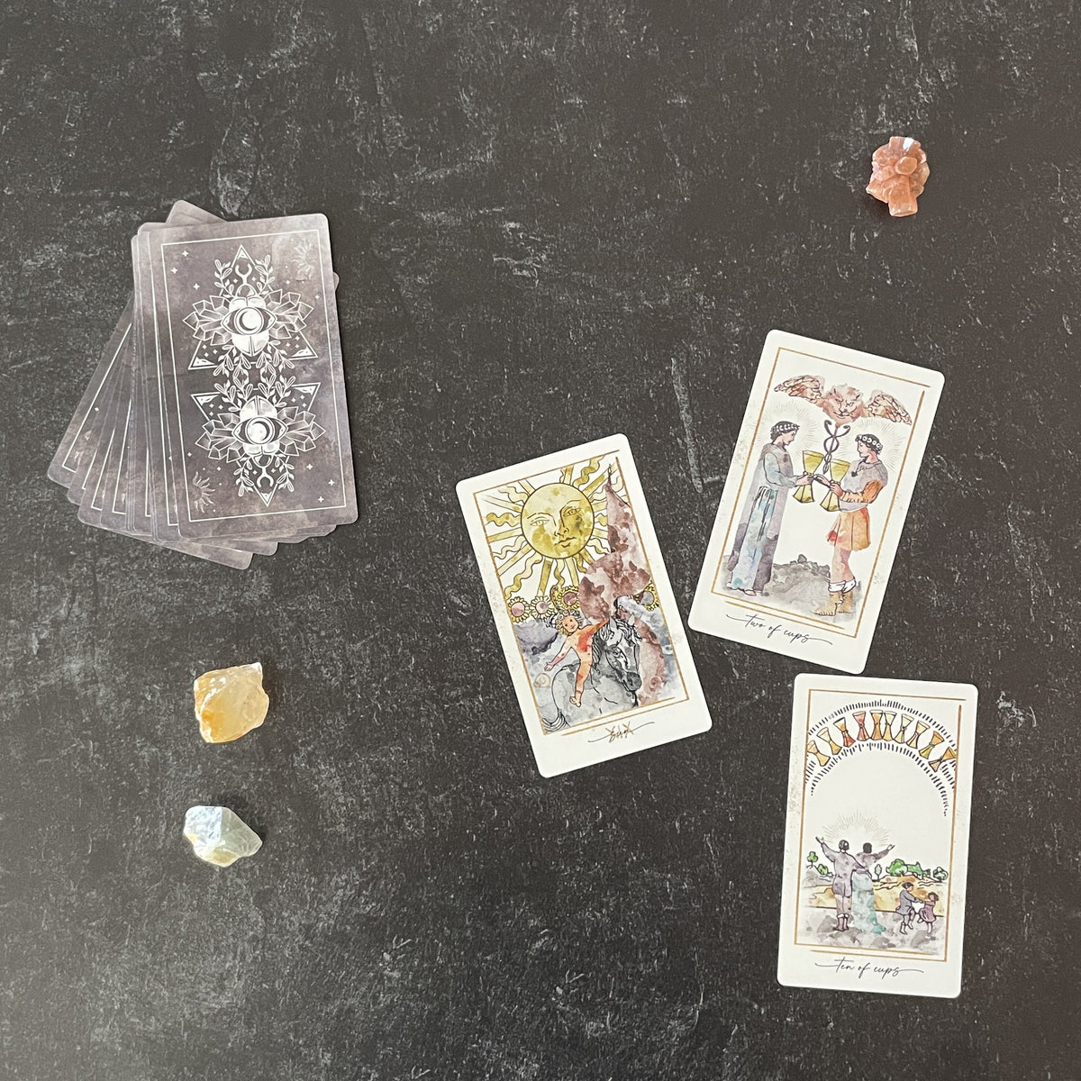 Modern Hue Tarot deck: Rider-Waite-Smith cards recolored in soft watercolor, fanned on a table (image 8)