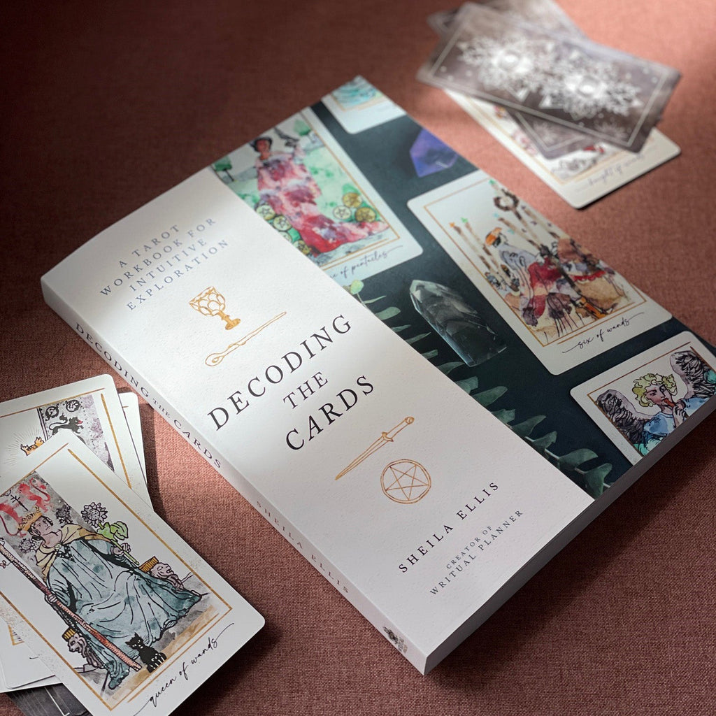 Decoding the Cards tarot workbook by Writual Press, open to a card exercise page