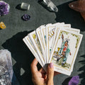 Modern Hue Tarot deck: Rider-Waite-Smith cards recolored in soft watercolor, fanned on a table