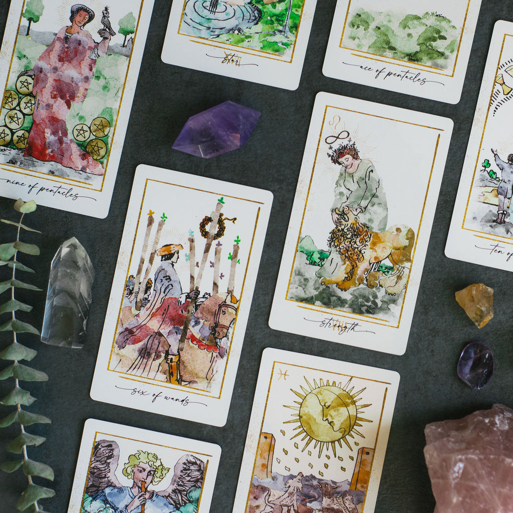 Modern Hue Tarot deck: Rider-Waite-Smith cards recolored in soft watercolor, fanned on a table (image 2)