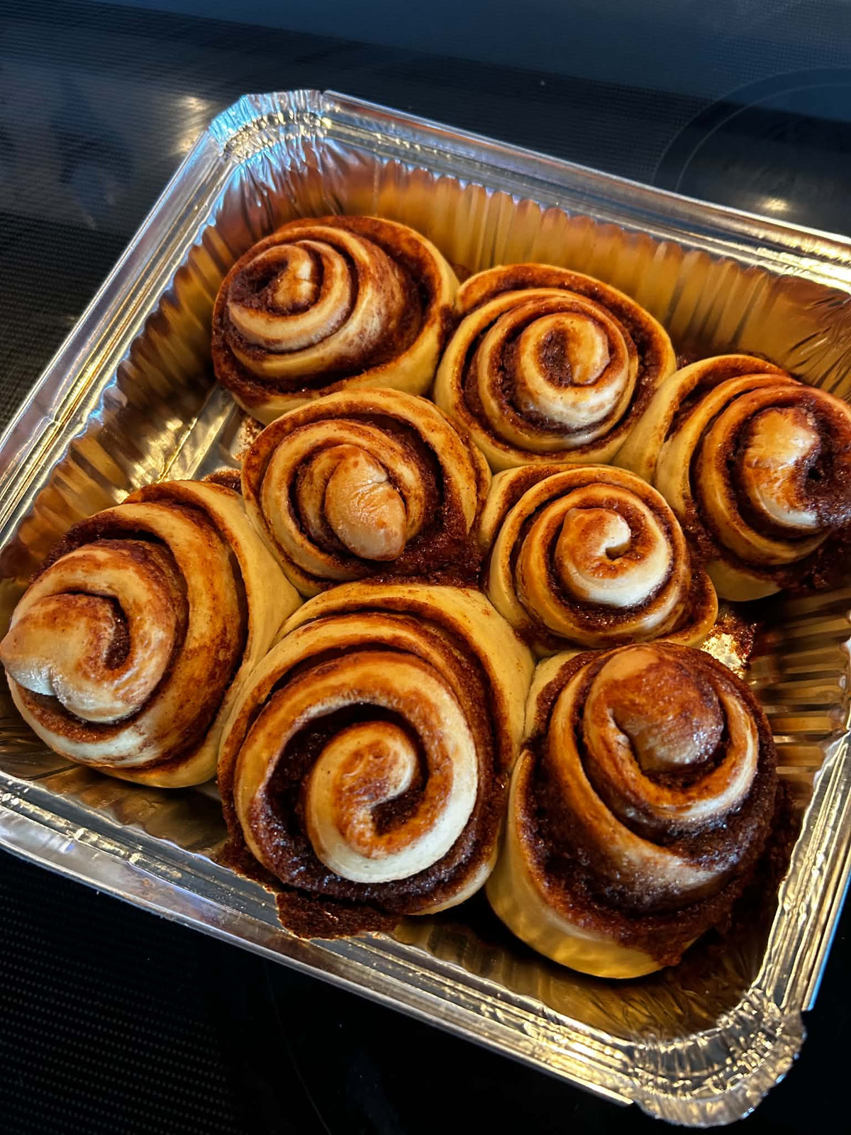 Eight freshly baked Baby Buns cinnamon rolls